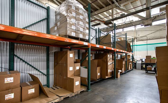 Industrial warehouse interior with high racking, pallet storage, and loading-ready floor plate