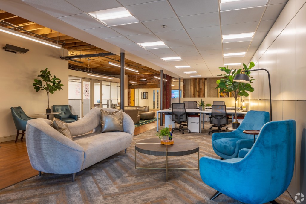 Contemporary Manhattan office interior with lounge seating and open workstations